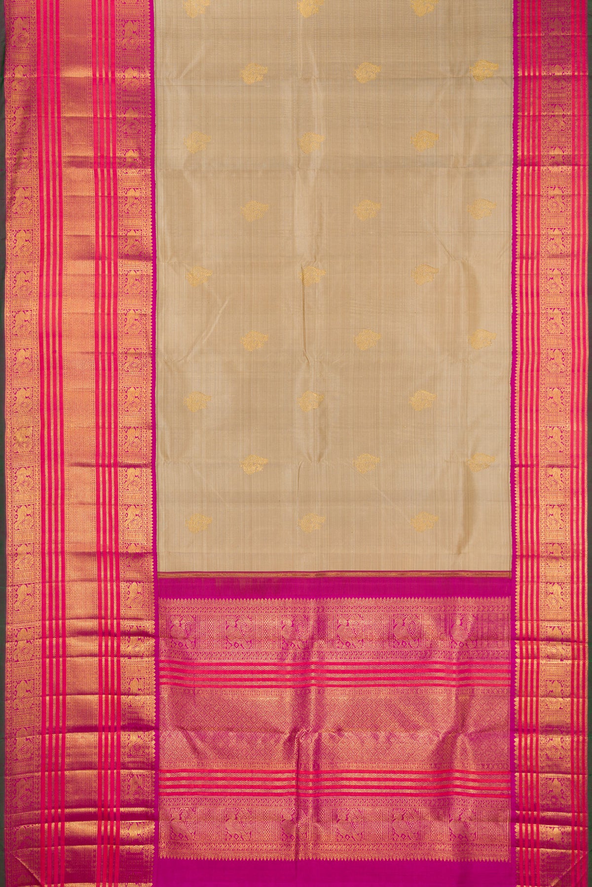 Flat view of Pure Silk Pure Zari Dark Beige Kanchipuram Saree with Zari Butta on the body and Zari Border. 