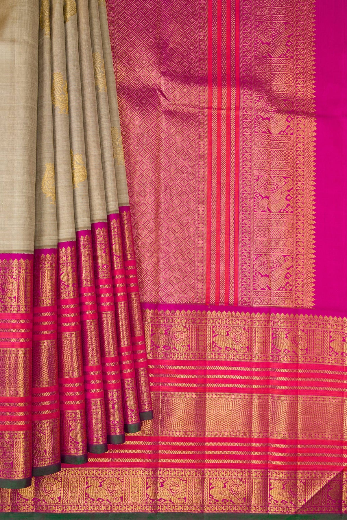 Pleats and pallu of Pure Silk Pure Zari Dark Beige Kanchipuram Saree with Zari Butta on the body and Zari Border. 