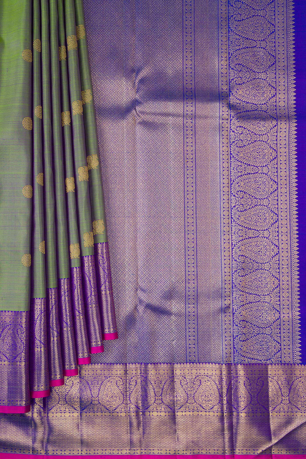Pleats and pallu of Pure Silk Pure Zari Green Kanchipuram Saree with Zari Butta on the body and Zari Border. 