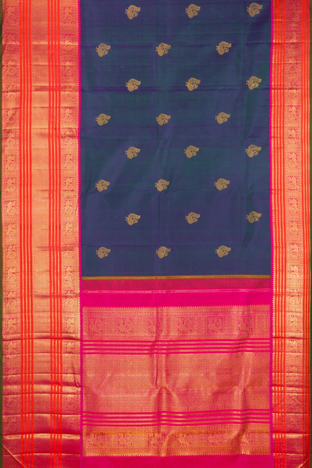 Flat view of Pure Silk Pure Zari Peacock Blue Dual Tone Kanchipuram Saree with Zari Butta on the body and Zari Border. 
