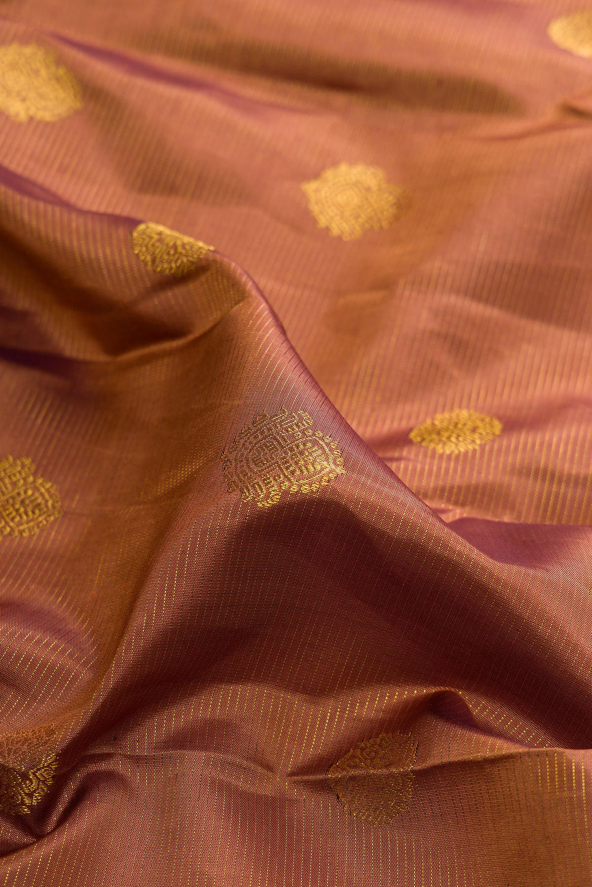 Close up of Pure Silk Brown Kanchipuram Saree with Stripes on the body and Fancy Border.  displaying folds