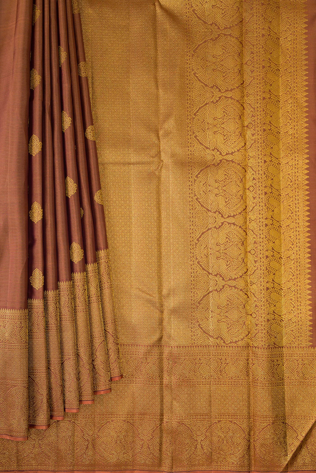 Pleats and pallu of Pure Silk Brown Kanchipuram Saree with Stripes on the body and Fancy Border. 