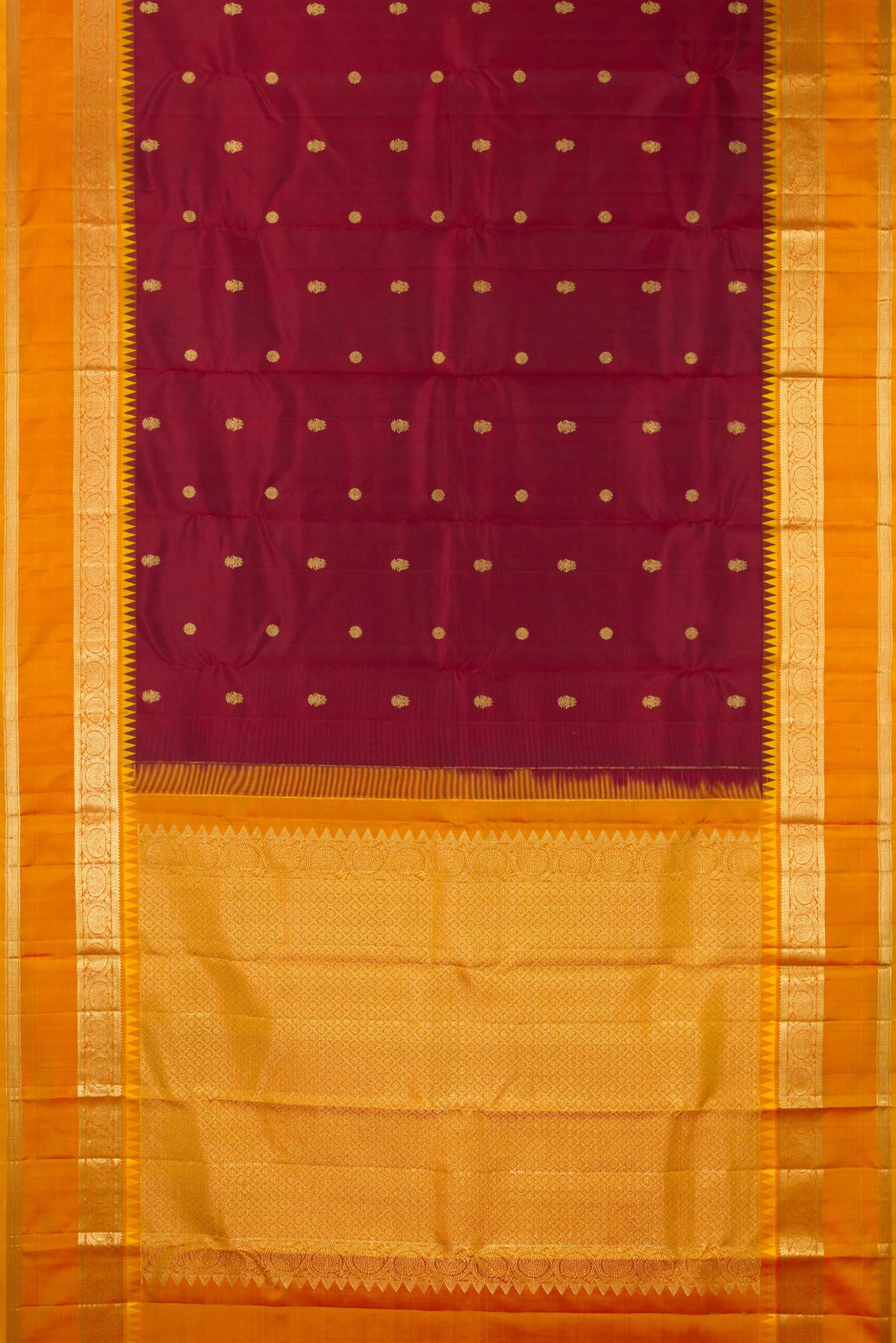 Flat view of Pure Silk Maroon Kanjivaram Saree with Zari Butta on the body and Zari Border. 
