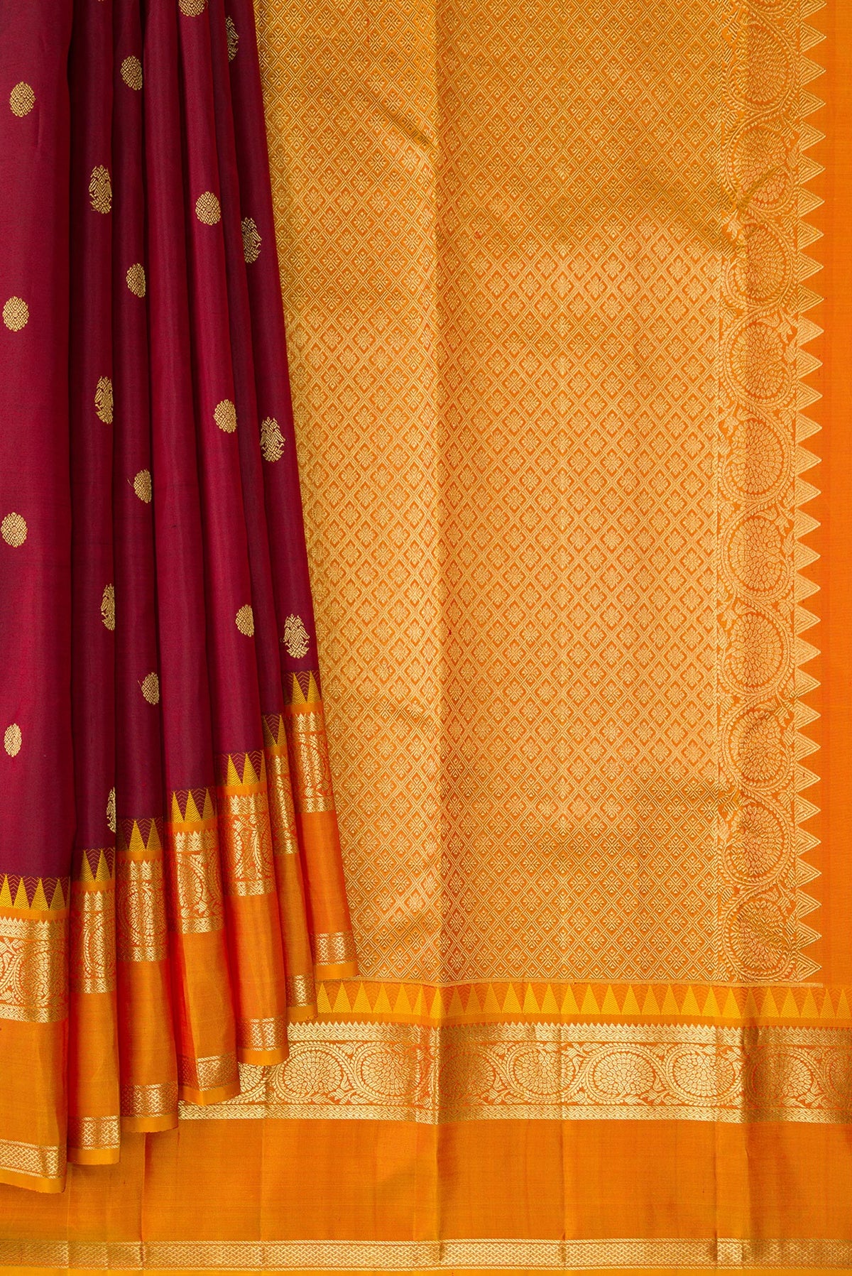 Pleats and pallu of Pure Silk Maroon Kanjivaram Saree with Zari Butta on the body and Zari Border. 