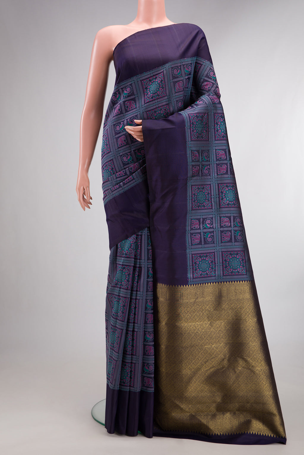 Pure Silk Navy Blue Kanjivaram Saree with Jacquard With Thread Butta on the body and Plain Border.  displayed on a mannequin