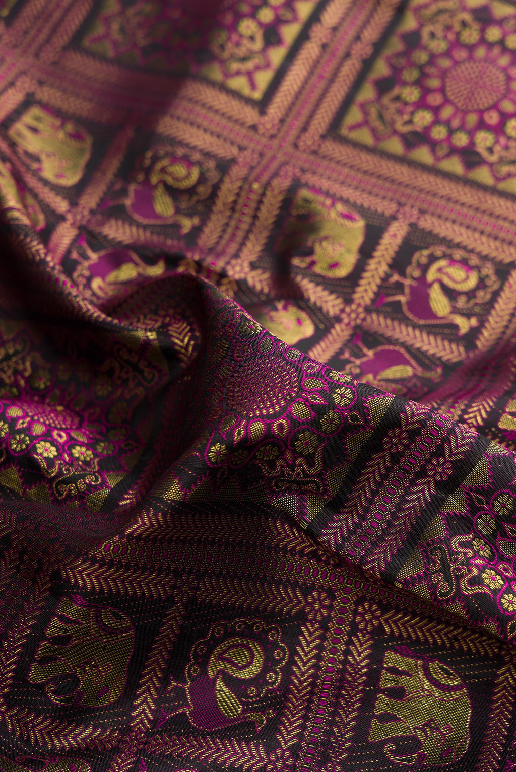 Close up of Pure Silk Black Dual Tone Kanjivaram Saree with Zari Brocade on the body and Plain Border.  displaying folds