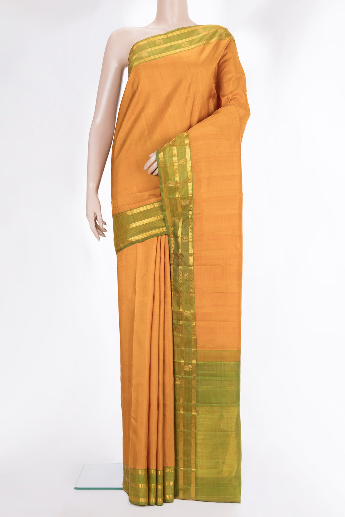 Pure Silk Mustard Dual Tone Kanchipuram Saree with Plain Body and Zari Border.  displayed on a mannequin