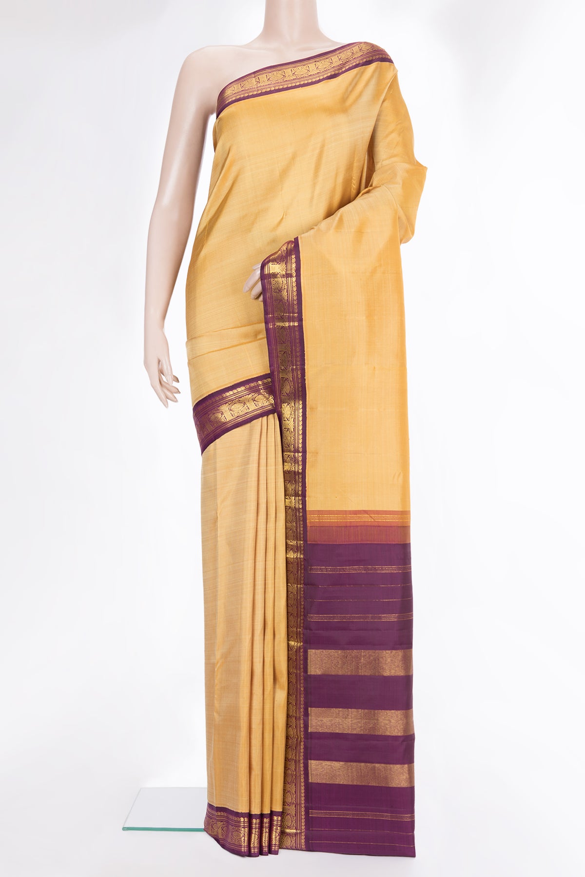 Pure Silk Sandal Dual Tone Kanjivaram Saree with Plain Body and Zari Border.  displayed on a mannequin