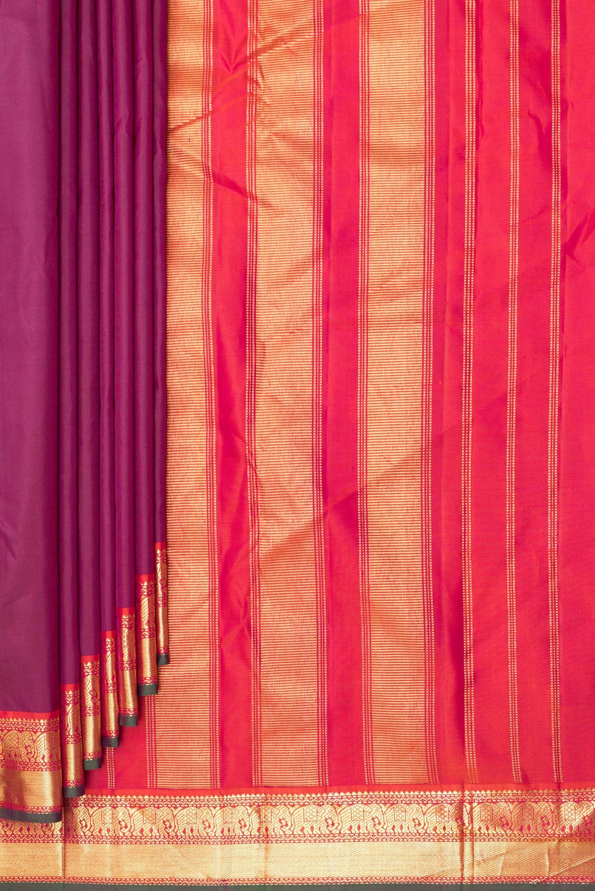 Pleats and pallu of Pure Silk Magenta Dual Tone Kanchipuram Saree with Plain Body and Zari Border. 