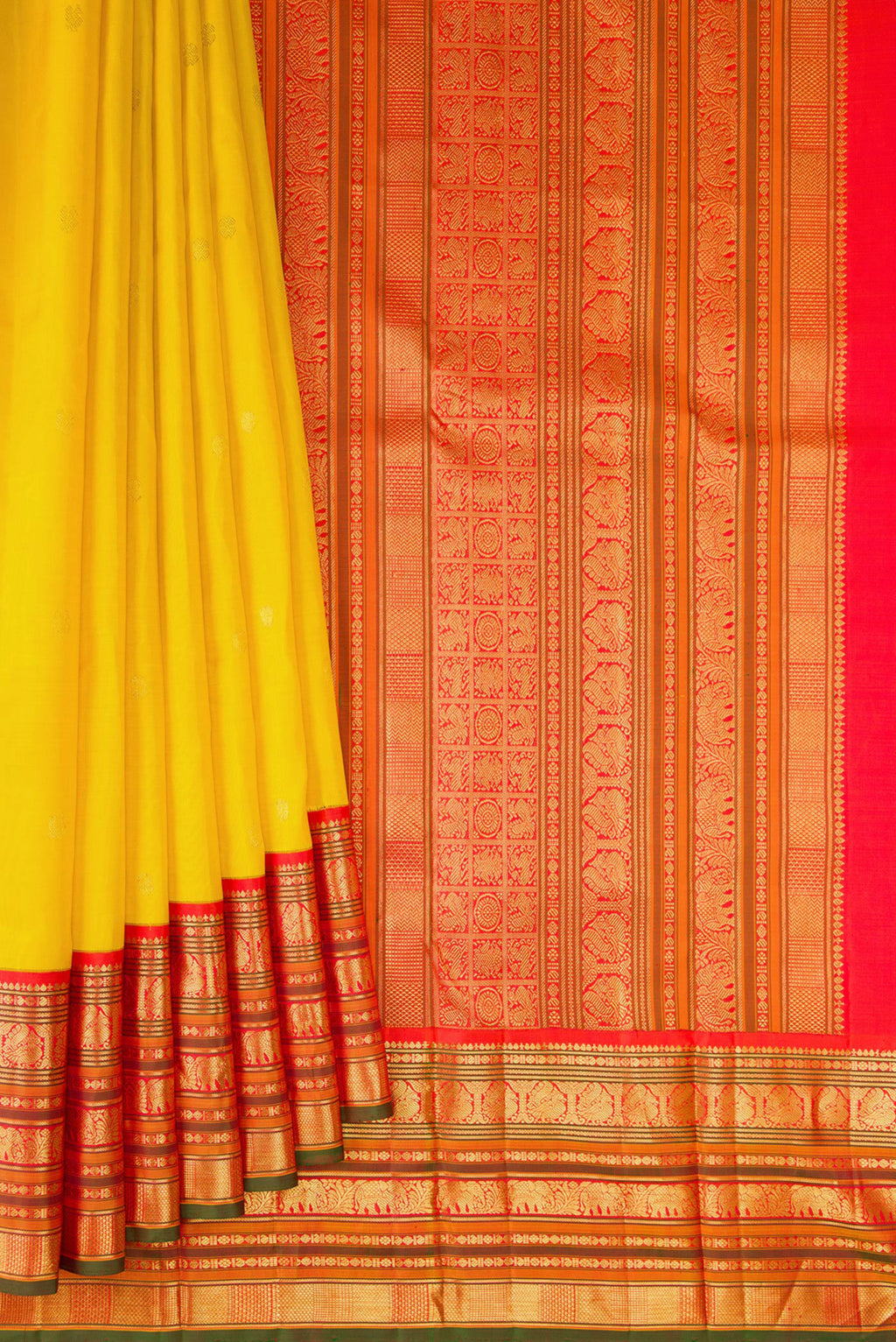 Pleats and pallu of Pure Silk Yellow Kanchipuram Saree with Zari Butta on the body and Zari Border. 