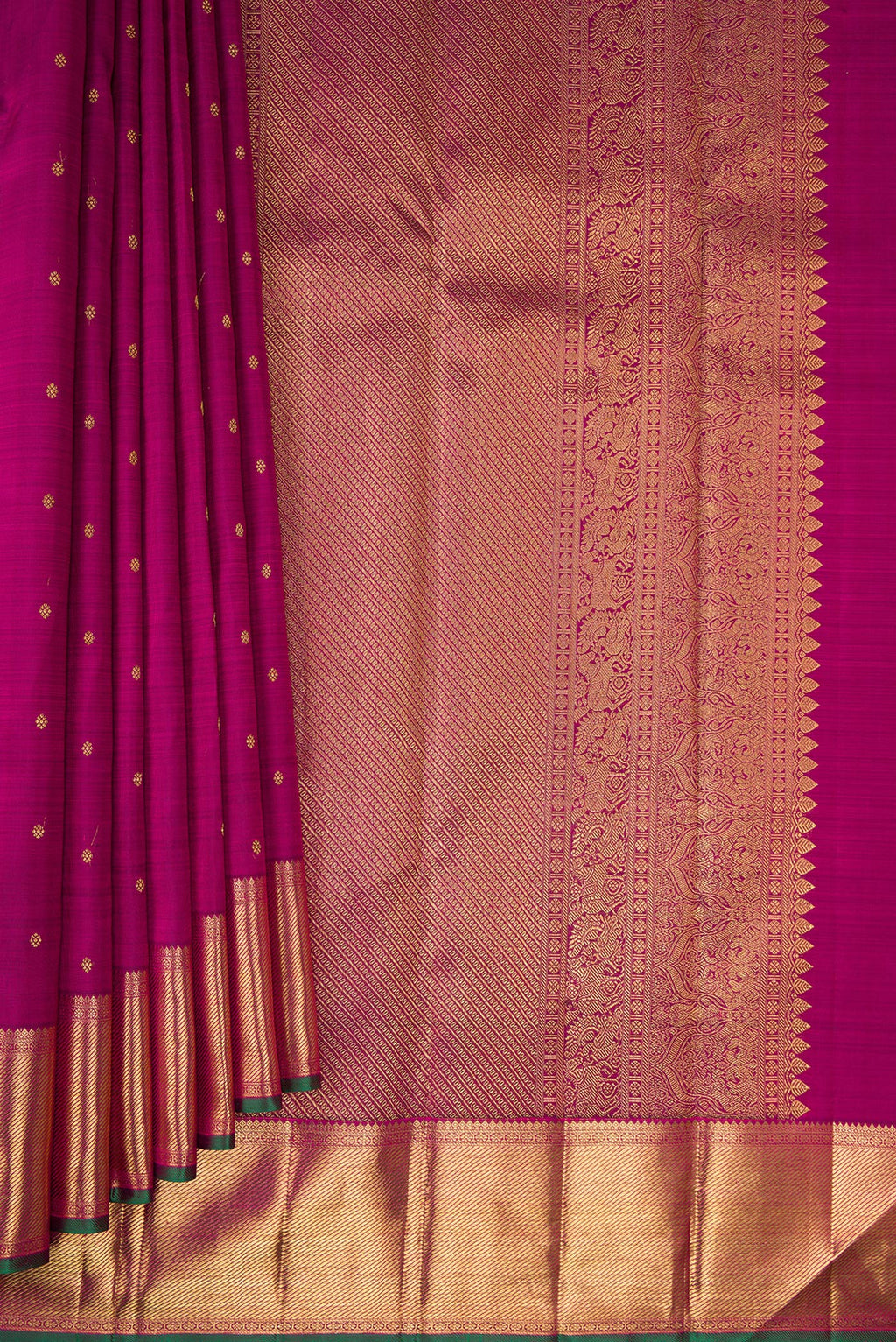Pleats and pallu of Pure Silk Pure Zari Magenta Kanjivaram Saree with Zari Butta on the body and Zari Border. 