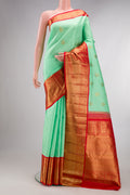 Pure Silk Pure Zari Sea Green Kanjivaram Saree with Zari Butta on the body and Zari Border.  displayed on a mannequin