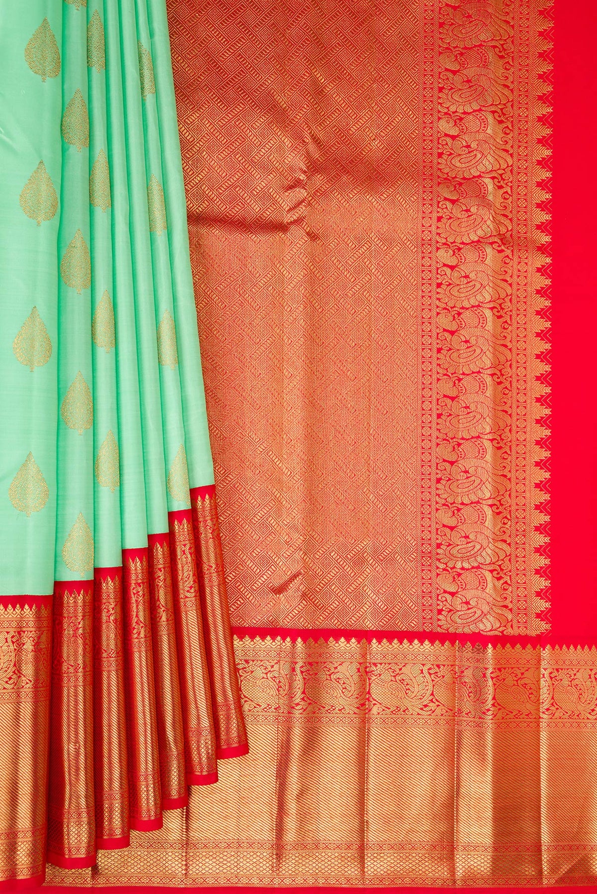 Pleats and pallu of Pure Silk Pure Zari Sea Green Kanjivaram Saree with Zari Butta on the body and Zari Border. 