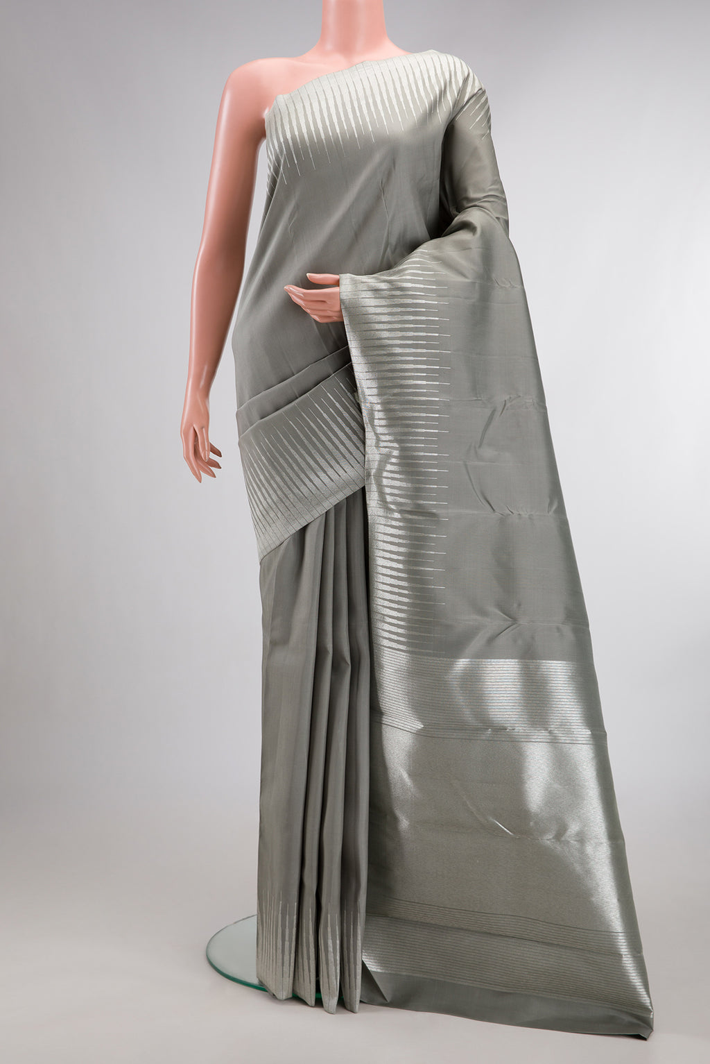 Pure Silk Pure Zari Grey Dual Tone Kanchipuram Saree with Plain Body and Fancy Border.  displayed on a mannequin