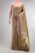Pure Silk Pure Zari Dark Beige Kanchipuram Saree with Zari Butta on the body and Fancy Border.  displayed on a mannequin