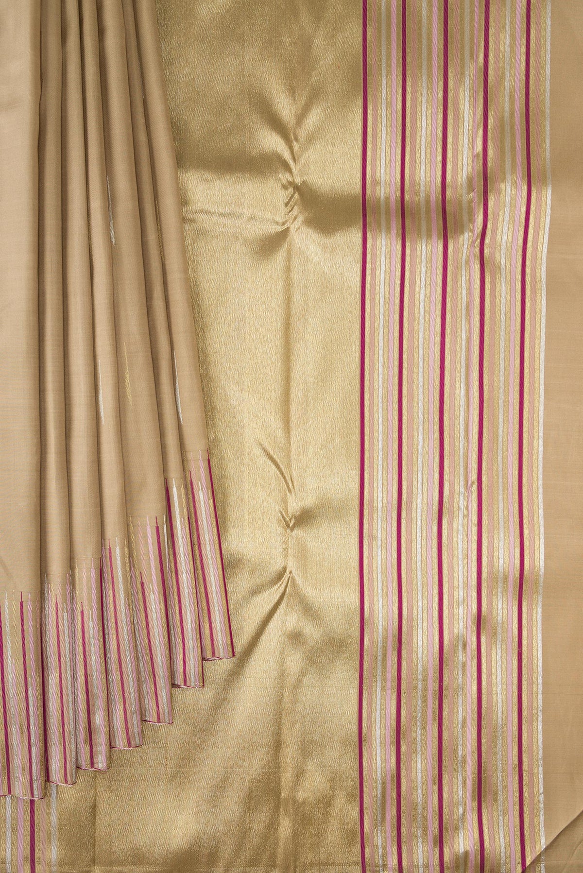 Pleats and pallu of Pure Silk Pure Zari Dark Beige Kanchipuram Saree with Zari Butta on the body and Fancy Border. 