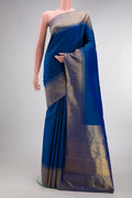 Pure Silk Blue Kanchipuram Saree with Plain Body and Zari Border.  displayed on a mannequin