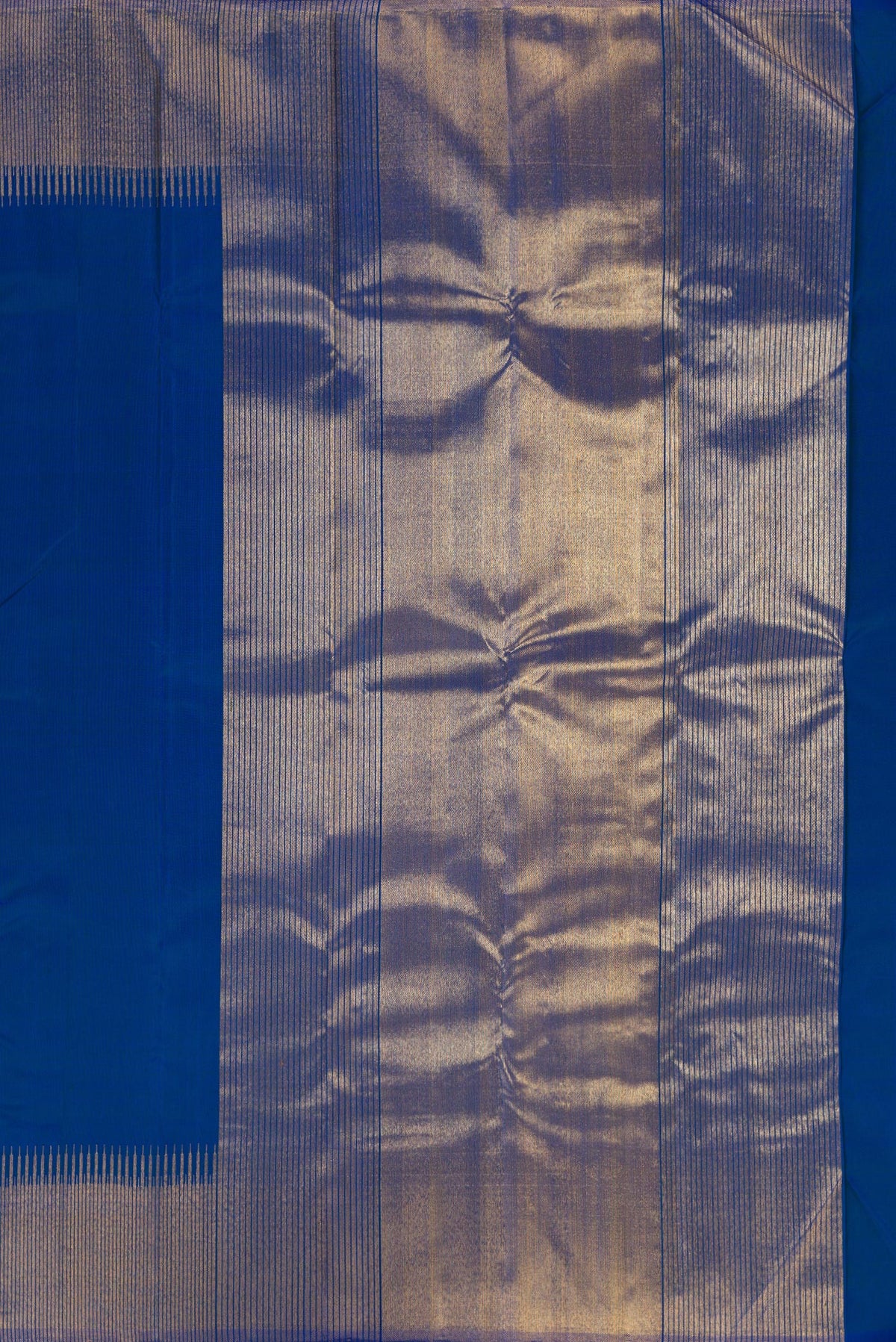 Close up image of the pallu of Pure Silk Blue Kanchipuram Saree with Plain Body and Zari Border. 