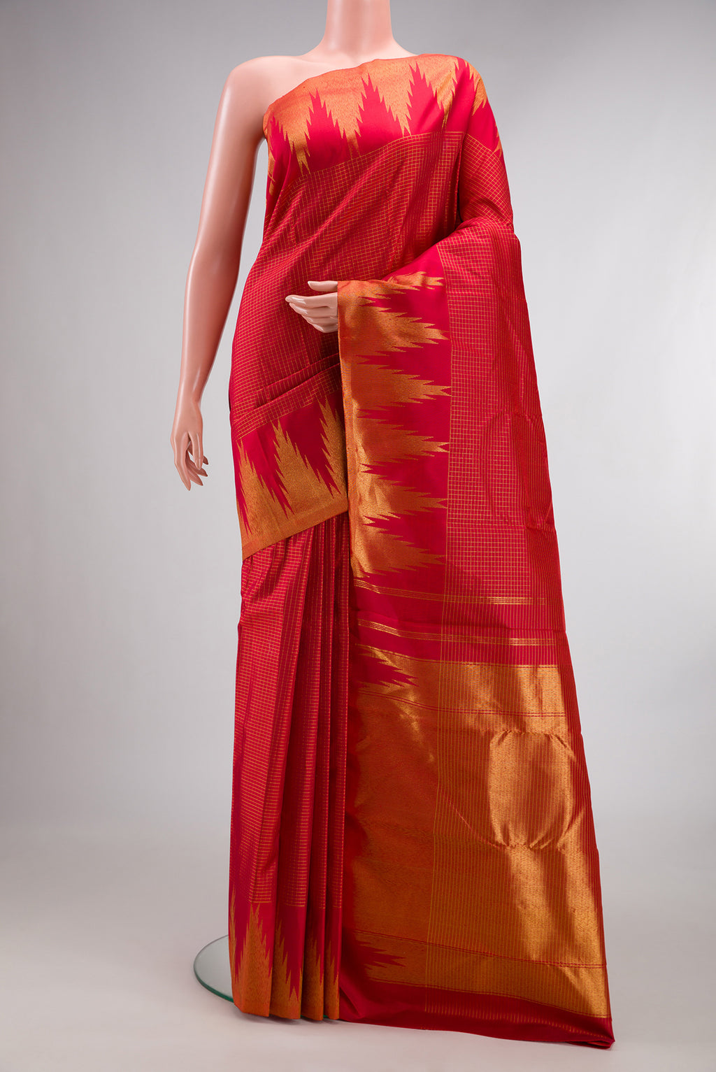Pure Silk Red Kanjivaram Saree with Checked design on the body and Temple Border.  displayed on a mannequin
