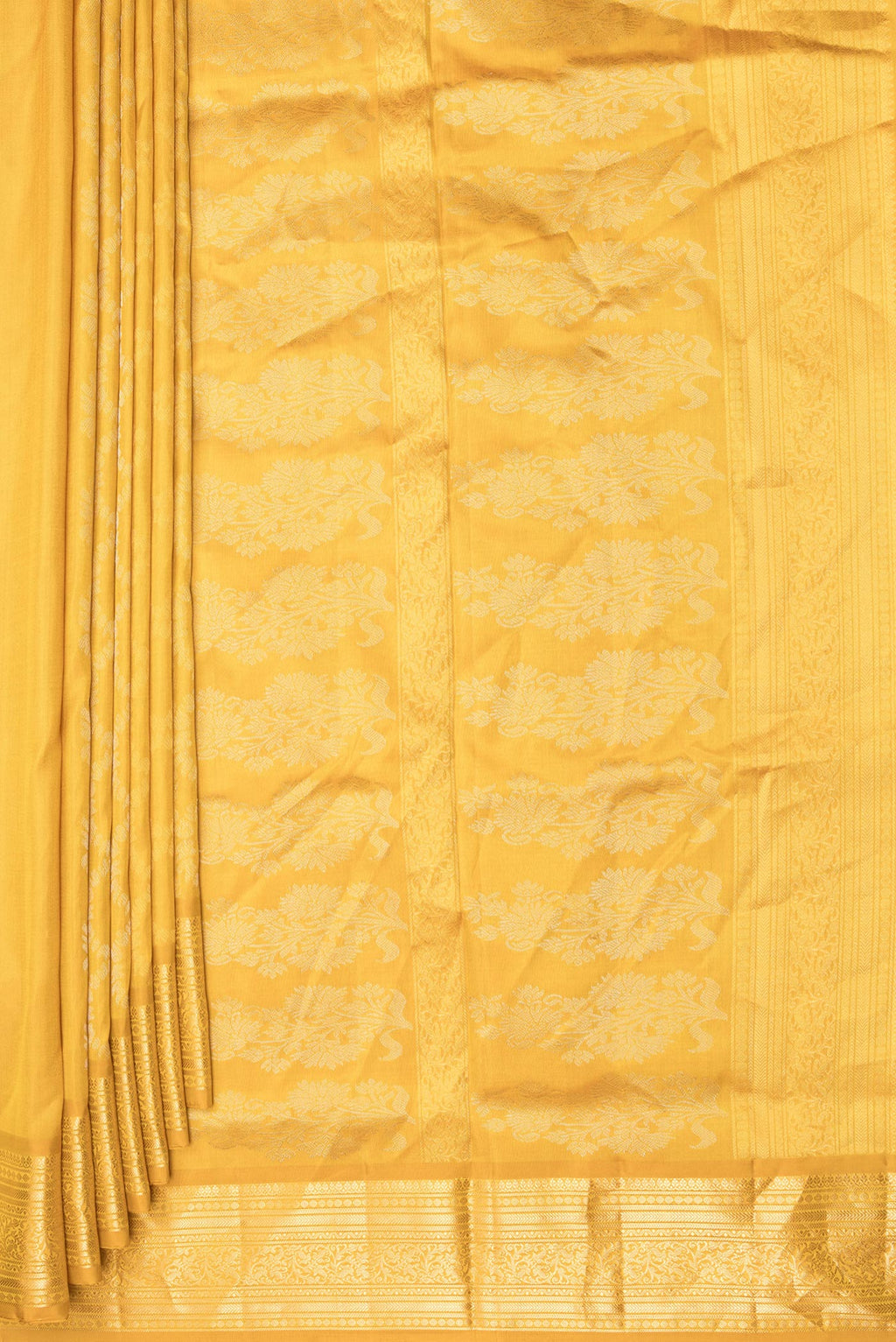 Pleats and pallu of Pure Silk Mustard Dual Tone Soft Saree with Zari Butta on the body and Zari Border. 