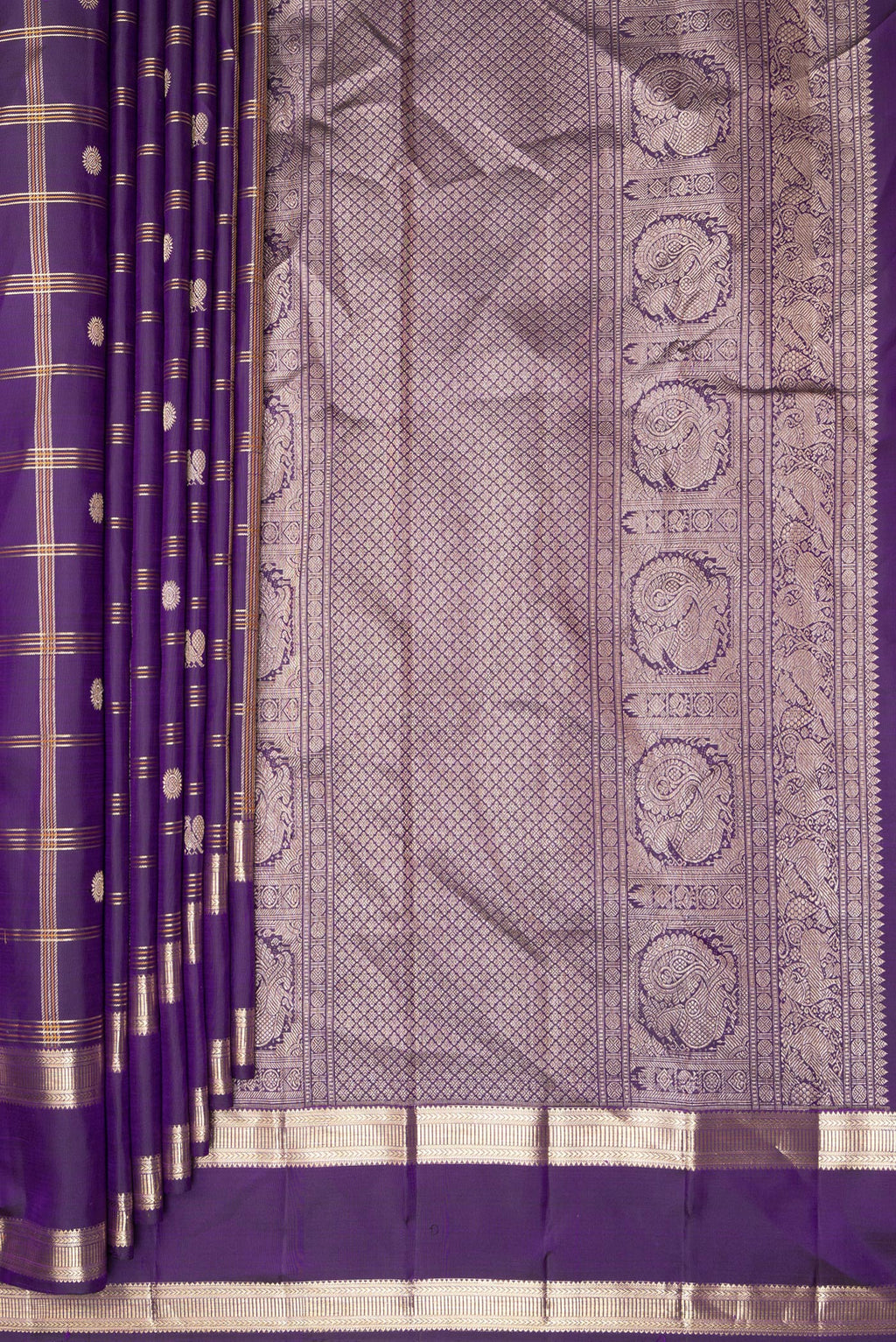 Pleats and pallu of Pure Silk Violet Kanchipuram Saree with Checked design on the body and Zari Border. 