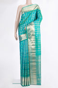 Pure Silk Sea Green Dual Tone Kanchipuram Saree with Checked design on the body and Zari Border.  displayed on a mannequin