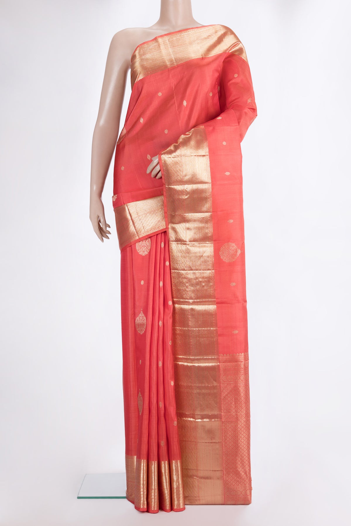 Pure Silk Orange Dual Tone Kanjivaram Saree with Zari Butta on the body and Zari Border.  displayed on a mannequin