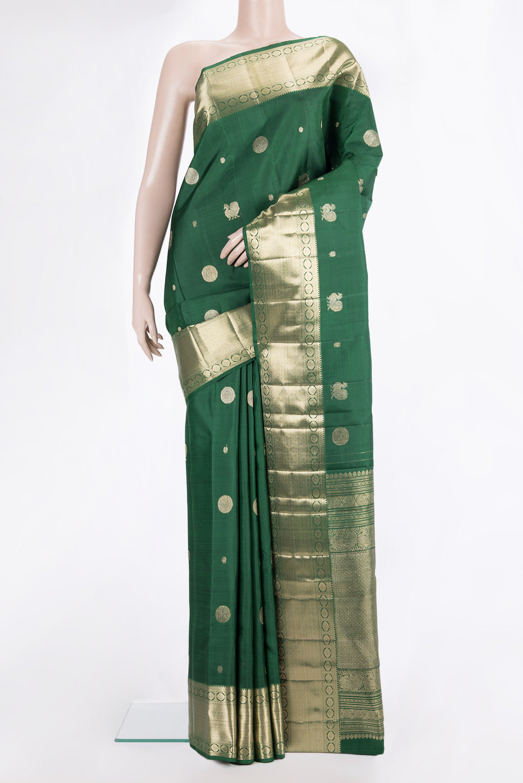 Pure Silk Bottle Green Kanjivaram Saree with Zari Butta on the body and Zari Border.  displayed on a mannequin