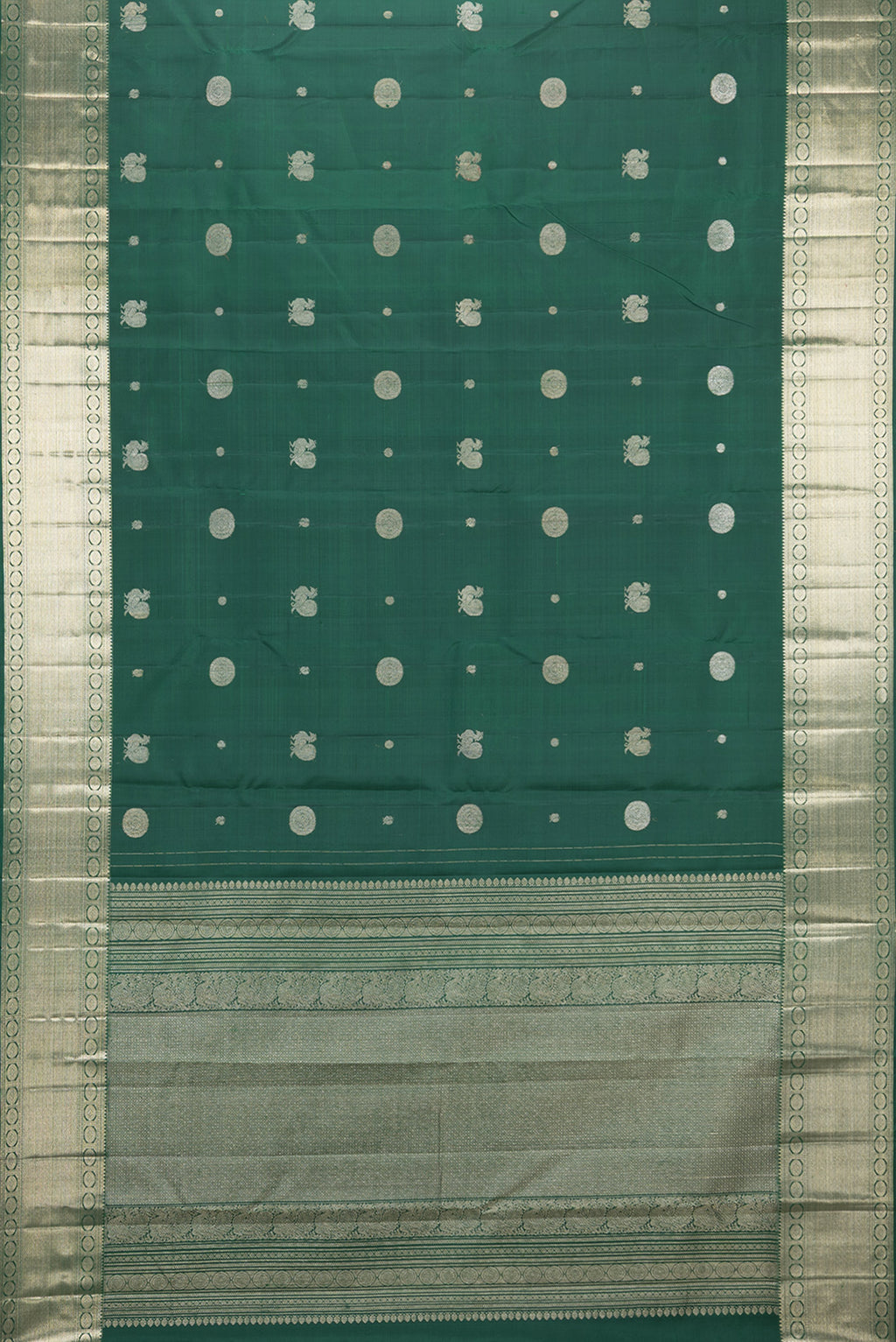 Flat view of Pure Silk Bottle Green Kanjivaram Saree with Zari Butta on the body and Zari Border. 