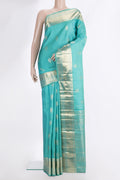 Pure Silk Turquoise Kanjivaram Saree with Zari Butta on the body and Zari Border.  displayed on a mannequin