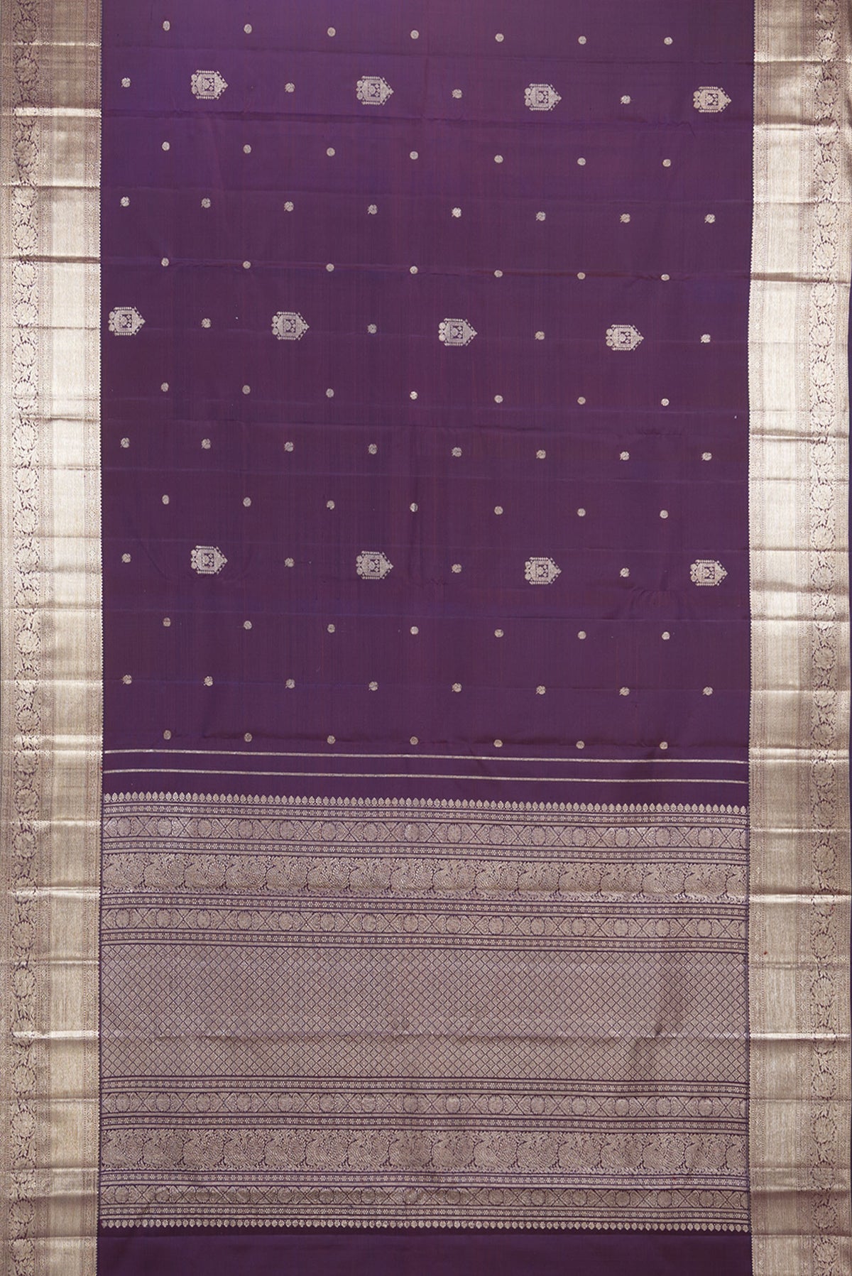Flat view of Pure Silk Burgundy Dual Tone Kanjivaram Saree with Zari Butta on the body and Zari Border. 