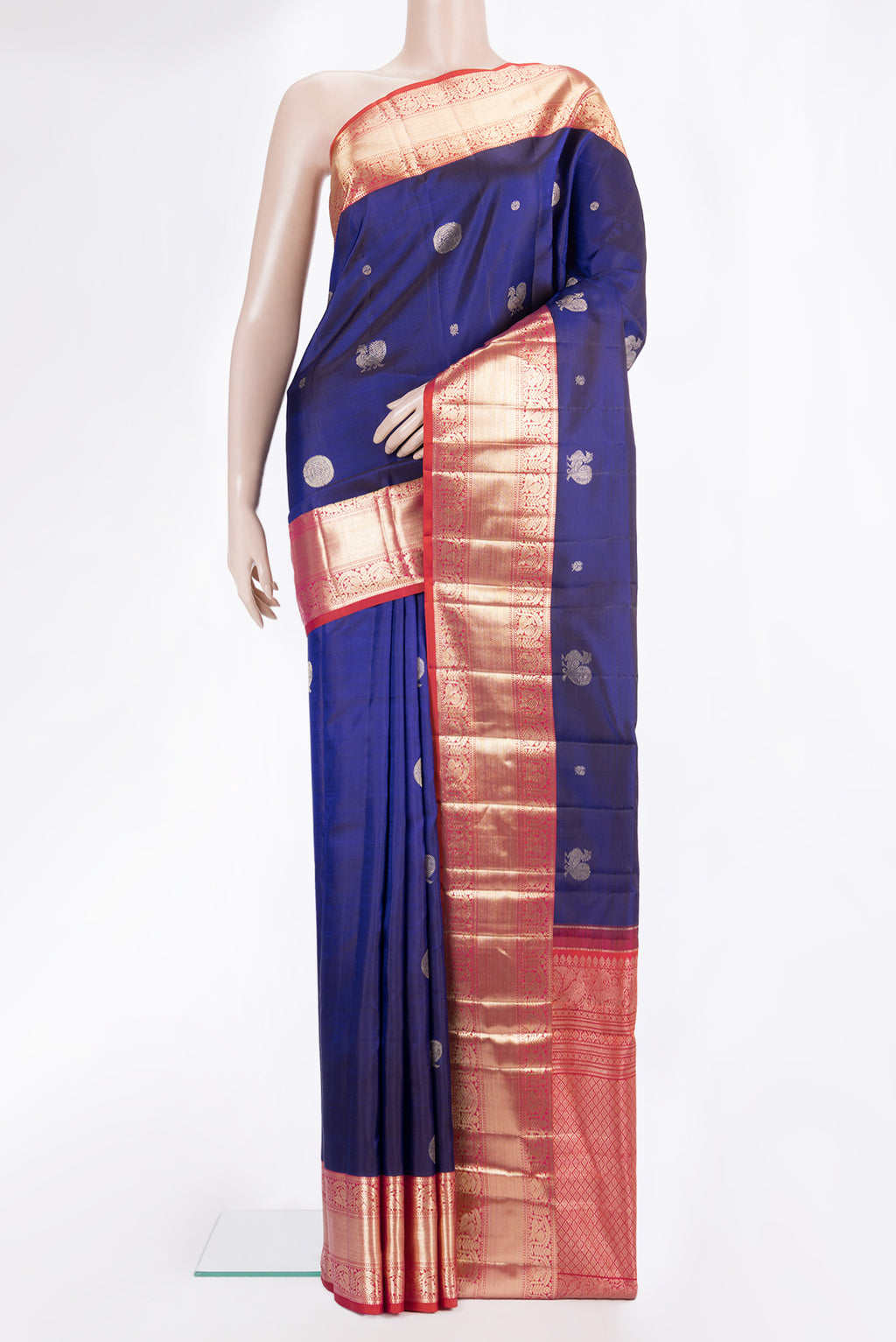 Pure Silk Navy Blue Dual Tone Kanchipuram Saree with Zari Butta on the body and Zari Border.  displayed on a mannequin