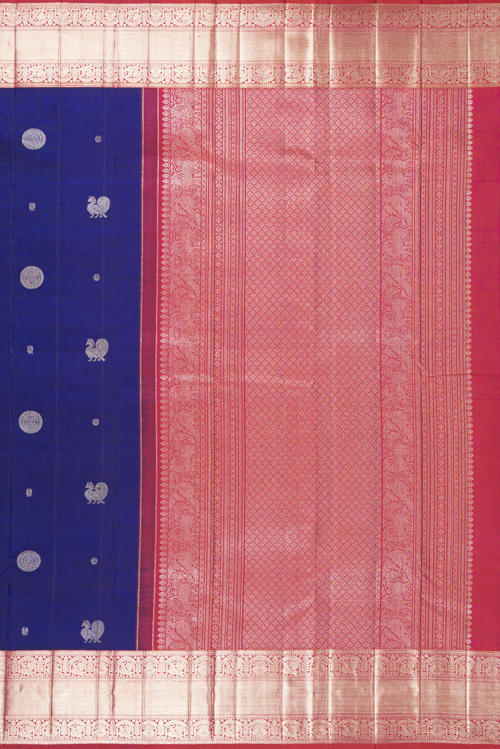 Close up image of the pallu of Pure Silk Navy Blue Dual Tone Kanchipuram Saree with Zari Butta on the body and Zari Border. 