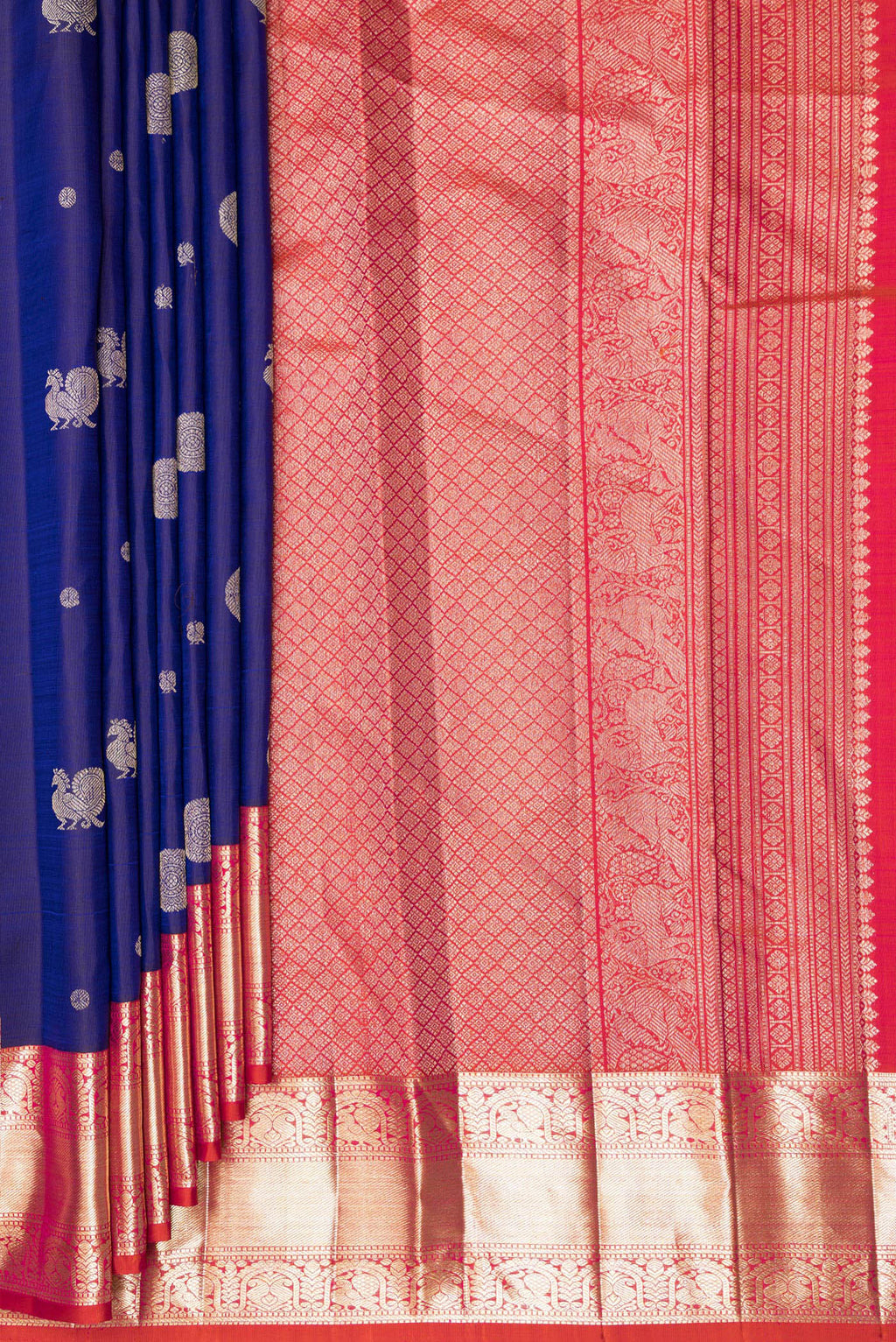 Pleats and pallu of Pure Silk Navy Blue Dual Tone Kanchipuram Saree with Zari Butta on the body and Zari Border. 