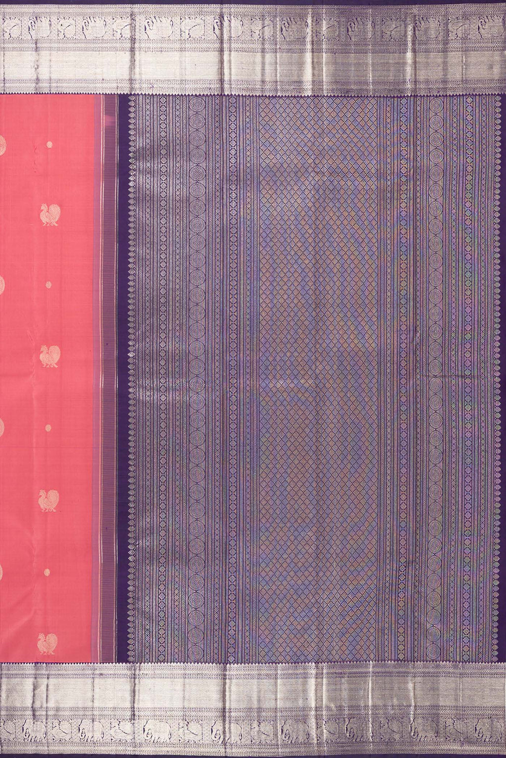 Close up image of the pallu of Pure Silk Brick Orange Kanchipuram Saree with Zari Butta on the body and Zari Border. 