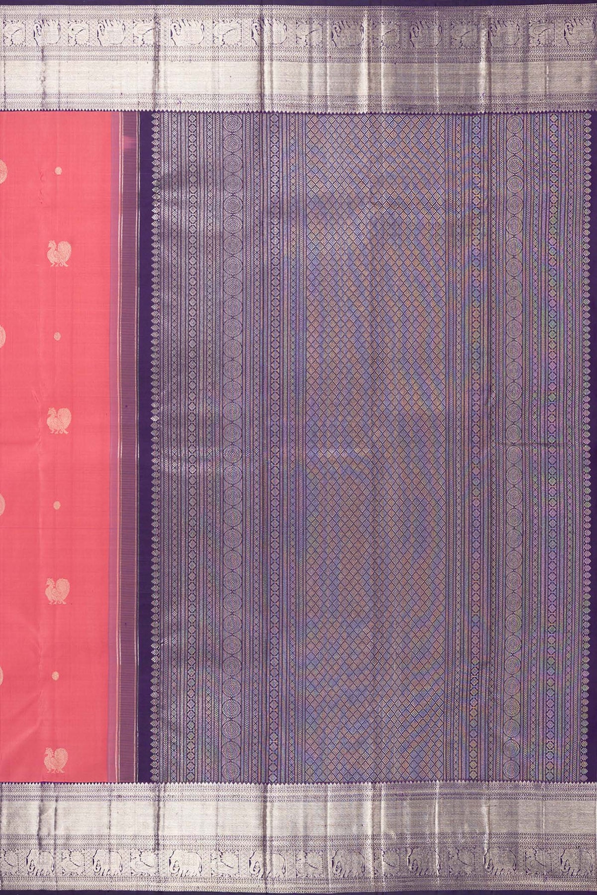 Close up image of the pallu of Pure Silk Brick Orange Kanchipuram Saree with Zari Butta on the body and Zari Border. 