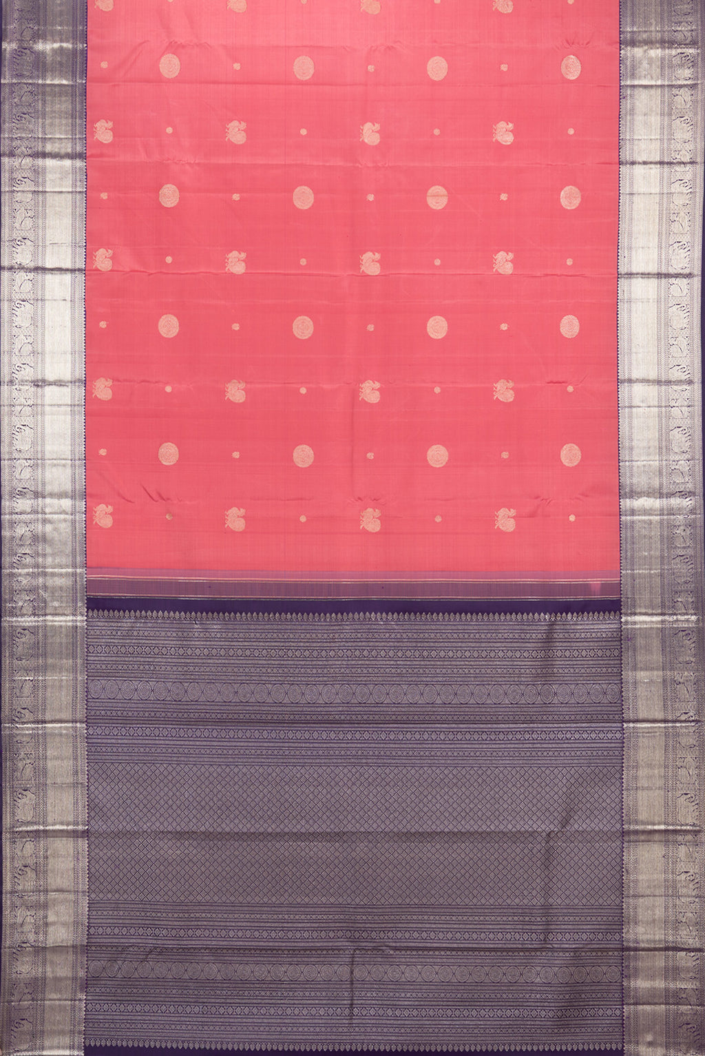 Flat view of Pure Silk Brick Orange Kanchipuram Saree with Zari Butta on the body and Zari Border. 