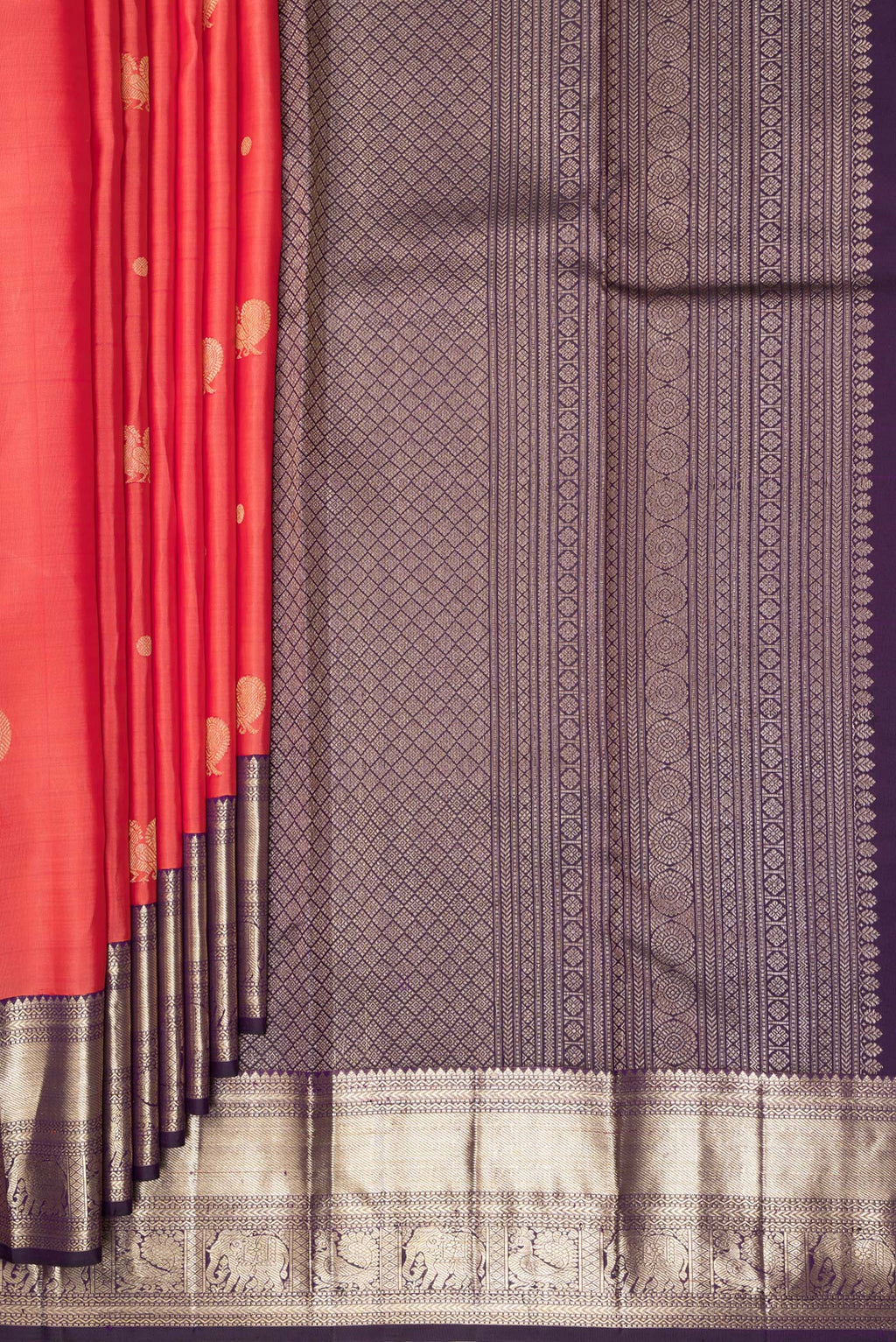 Pleats and pallu of Pure Silk Brick Orange Kanchipuram Saree with Zari Butta on the body and Zari Border. 