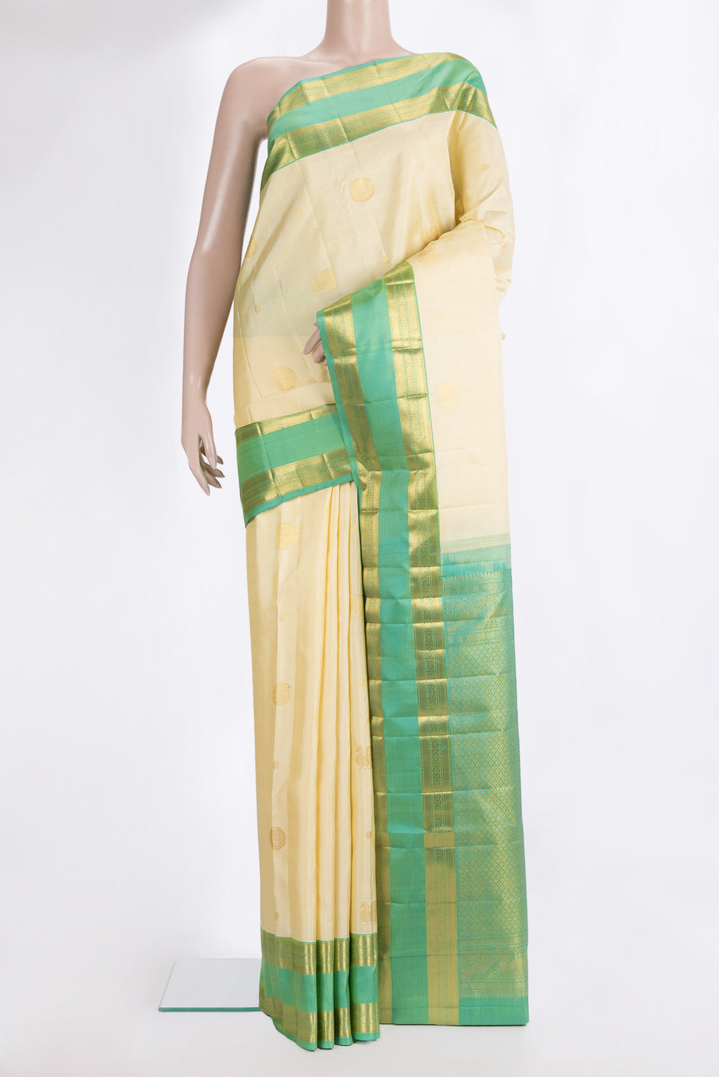 Pure Silk Cream Kanchipuram Saree with Zari Butta on the body and Zari Border.  displayed on a mannequin
