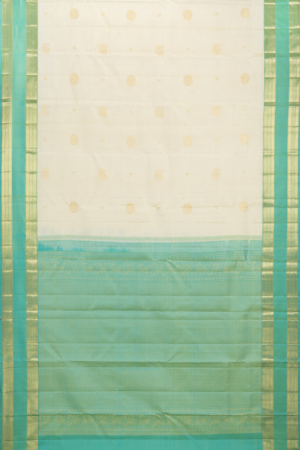 Flat view of Pure Silk Cream Kanchipuram Saree with Zari Butta on the body and Zari Border. 