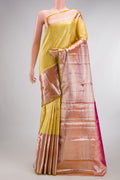 Pure Silk Lemon Yellow Kanjivaram Saree with Zari Brocade on the body and Zari Border.  displayed on a mannequin