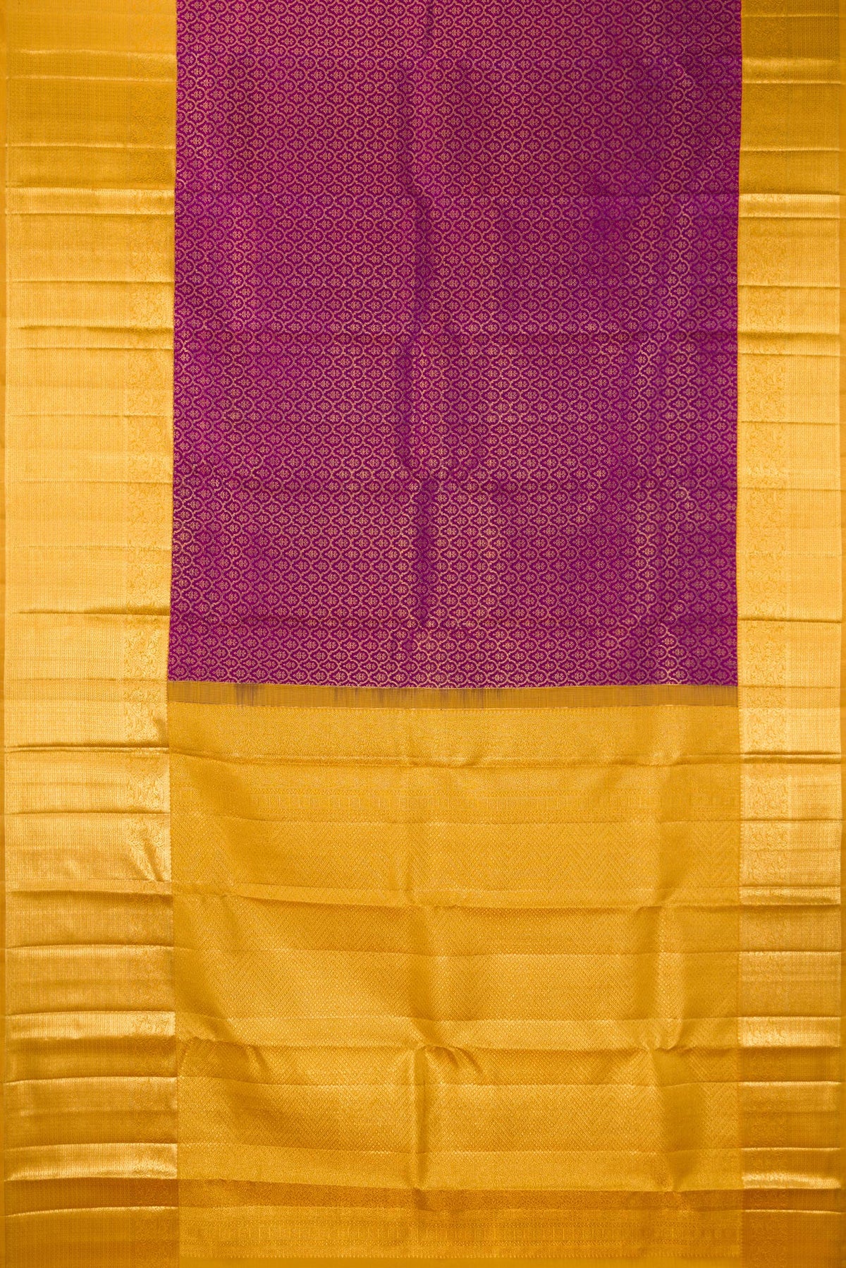 Flat view of Pure Silk Magenta Kanchipuram Saree with Zari Brocade on the body and Zari Border. 