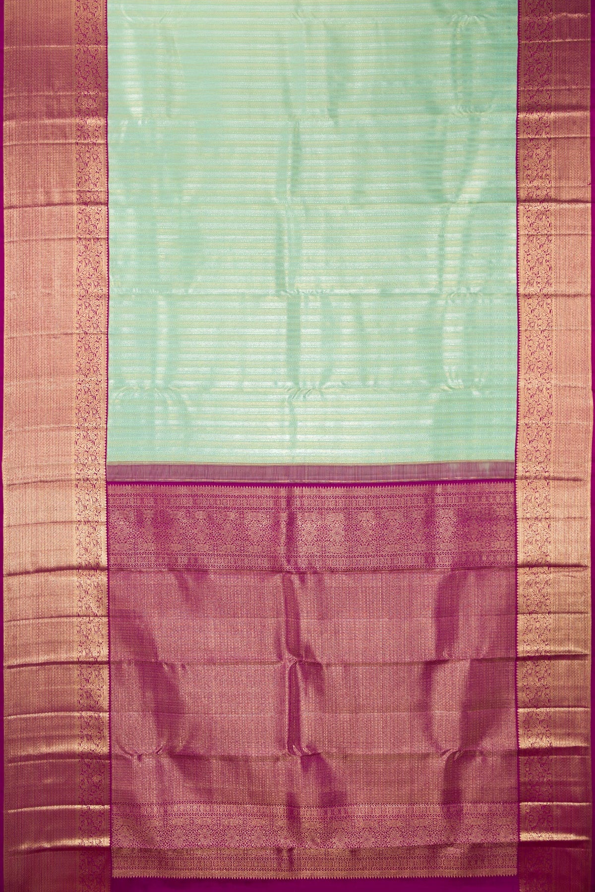 Flat view of Pure Silk Pista Green Kanchipuram Saree with Zari Brocade on the body and Zari Border. 