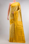 Yellow Dual Tone Kanjivaram Tissue Saree with Zari Brocade on the body and Zari Border.  displayed on a mannequin