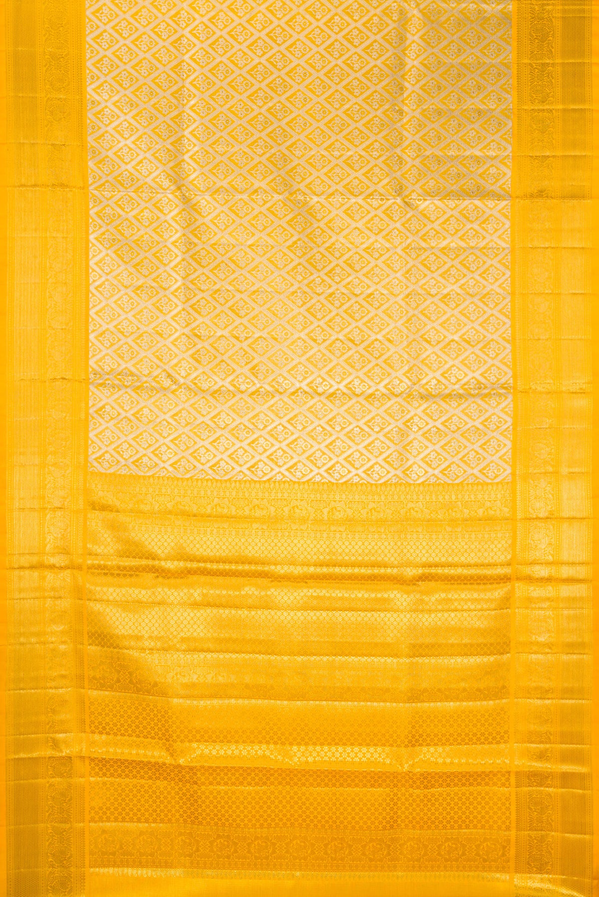 Flat view of Yellow Dual Tone Kanjivaram Tissue Saree with Zari Brocade on the body and Zari Border. 