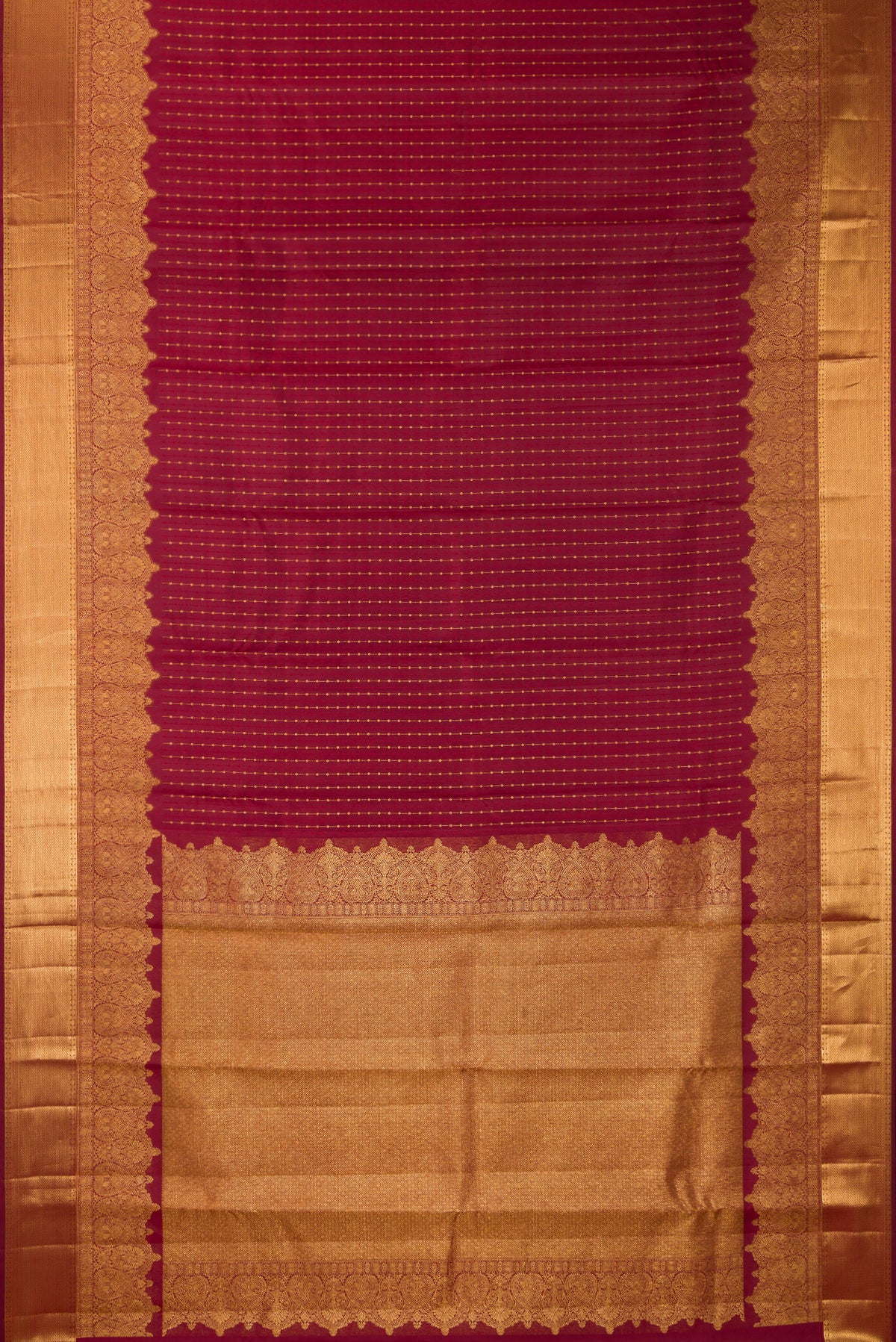 Flat view of Pure Silk Maroon Kanjivaram Saree with Zari Butta on the body and Fancy Border. 