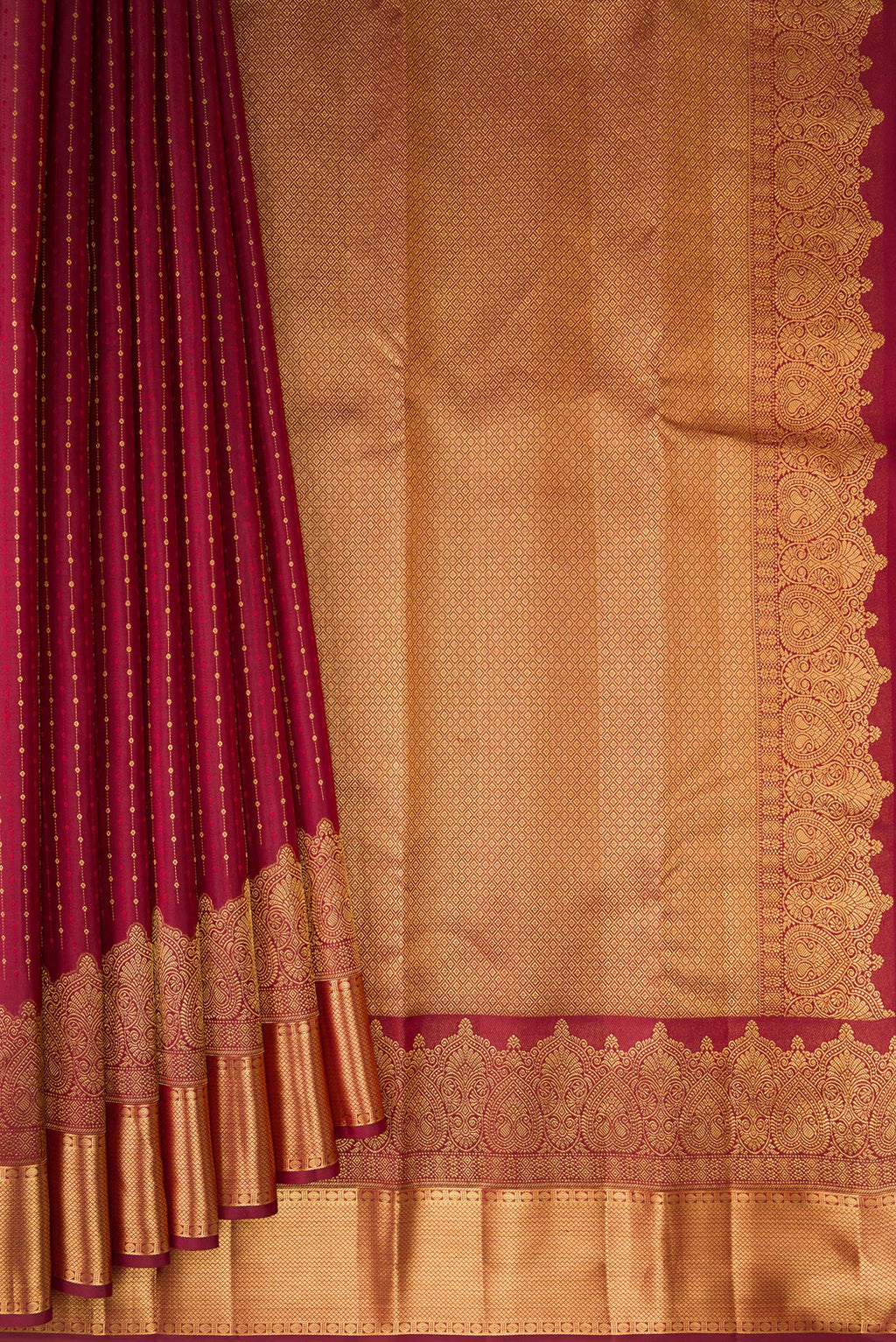 Pleats and pallu of Pure Silk Maroon Kanjivaram Saree with Zari Butta on the body and Fancy Border. 