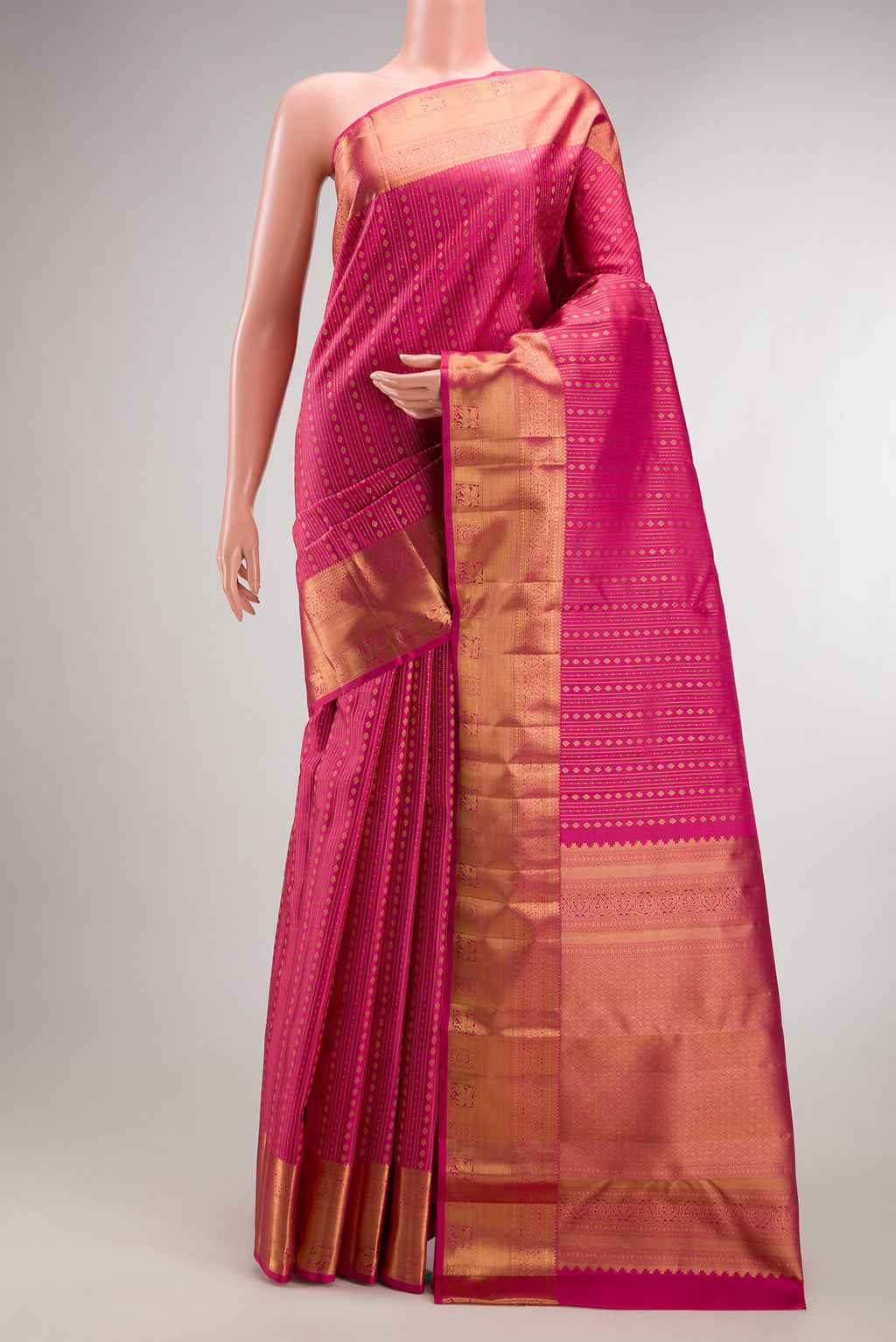 Pure Silk Pink Kanjivaram Saree with Stripes on the body and Zari Border.  displayed on a mannequin