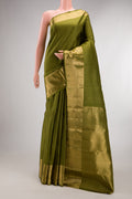 Pure Silk Mehandi Green Kanjivaram Saree with Zari Butta on the body and Zari Border.  displayed on a mannequin