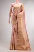 Pure Silk Golden Peach Kanjivaram Saree with Zari Butta on the body and Zari Border.  displayed on a mannequin